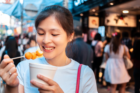 Girl Trying Hong Kong Local Street Food - Curry Fish Balls