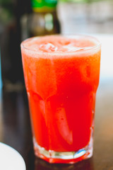 Glass of healthy watermelon juice on a wodden table