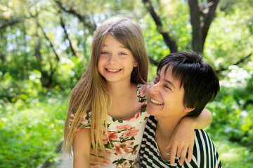 Fototapeta premium mother is playing with his daughter in the nature