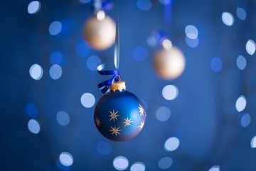 Fototapeta na wymiar Blue and White Christmas Ornaments Hanging