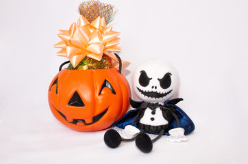 Postcard for Halloween, pumpkin with candies and a ghostly monster doll. On a white background.