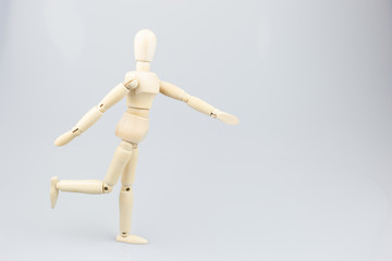 Wooden mannequin on white background.