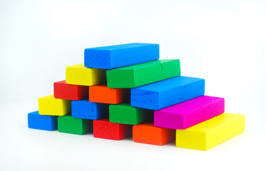 Obraz premium Arrangement of colorful wooden block on white background