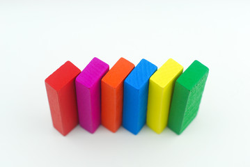 Obraz premium Arrangement of colorful wooden block on white background