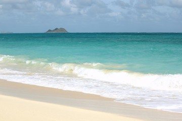 Remote Hawaiian Beach with an Island on the Horizon