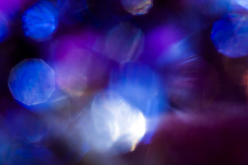 Blue specks of light on black background