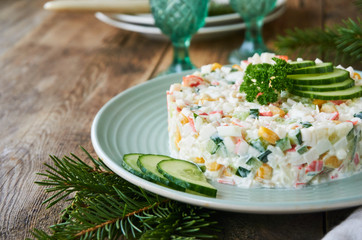 Salad with crab sticks, vegetables, rice and eggs