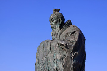 Figure sculpture in the blue sky in a park