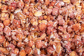 Organic homemade Granola Cereal with oats and almond. Texture oatmeal granola or muesli as background.