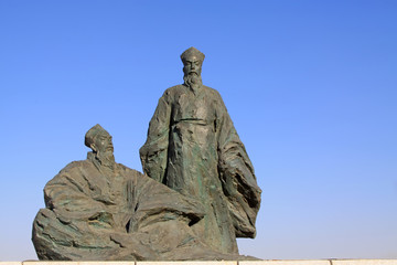 Figure sculpture in the blue sky in a park