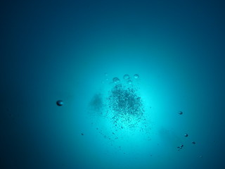 Scuba Diver Bubbles in Blue Sea  in the Waters of Bunaken Island, Diving Bunaken, Indonesia.