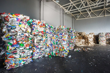 Plastic bales of rubbish at the waste treatment processing plant. Recycling separatee and storage...
