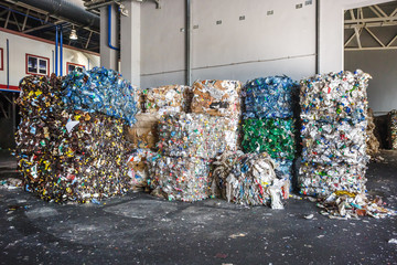 Plastic bales of rubbish at the waste treatment processing plant. Recycling separatee and storage...