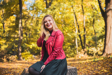 Happy smiling beautiful plus size model . Close up large girl smiling on a sunny day with good mood, Photo of new age standard of beauty, autumn time 
