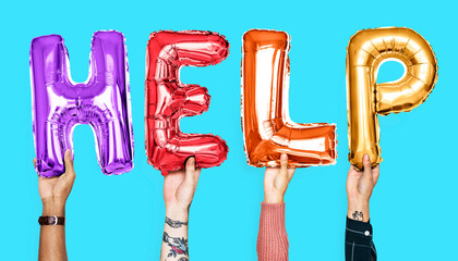 Colorful alphabet balloons forming the word help