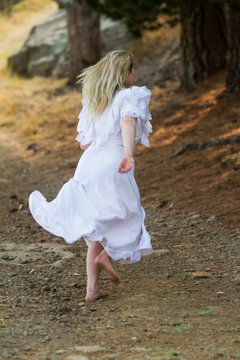 Girl In White Dress Running Away