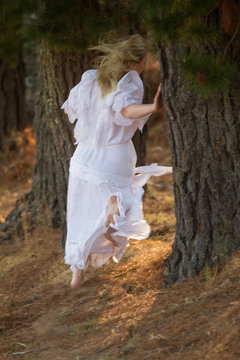 girl in white dress running away