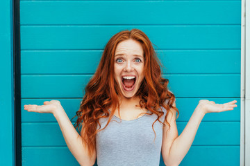 Excited young woman gesturing with her hands