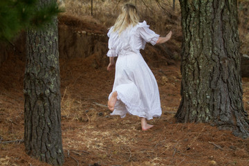 girl in white dress running away