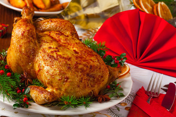 Roasted whole chicken with Christmas decoration.
