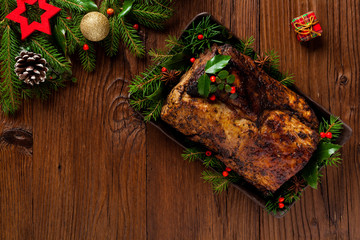 Roast pork loin with Christmas decoration.