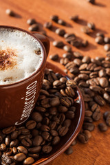 Cup of coffee with coffee beans, fresh brewed.