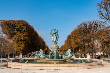Fototapeta na wymiar The Fontaine de l' Observatoire , monumental fountain located in the Jardin Marco Polo, Paris, France.