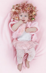 Little girl with a wreath of flowers on her head