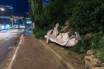 Decorative bench near the Crazy house on the embankment in the old district of Tel Aviv in Israel