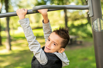 Fototapeta premium A boy having fun on the park playground