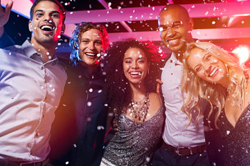Friends having fun at party with confetti - obrazy, fototapety, plakaty