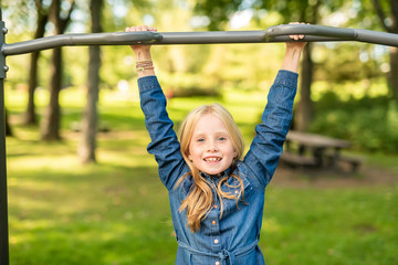 Fototapeta premium An Adorable little girl enjoying her time in park