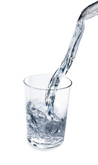Water poured into a glass isolated on white