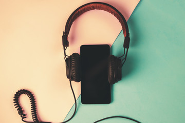phone and headphones in different pastel colors
