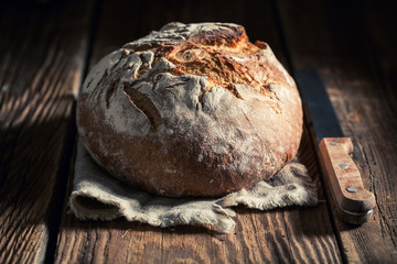 Healthy loaf of bread in rustic kitchen