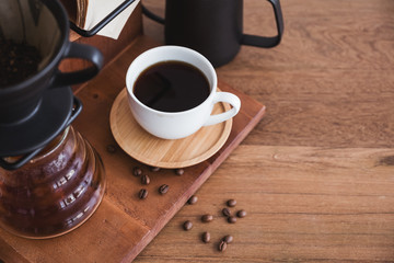 Top view image of drip coffee set on vintage wooden background