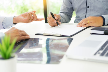 doctor giving a consultation discussing to patient and explaining medical informations and diagnosis, Medicine and health care concept