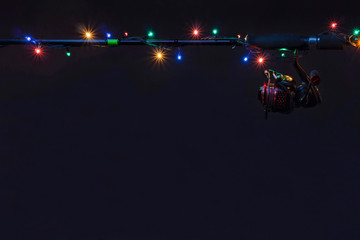 New year fishing concept. Holiday garland with tackles