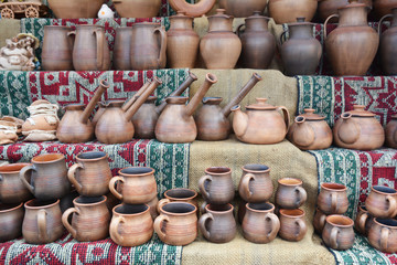 Fototapeta na wymiar Ceramic cezves and cups. Turkish coffee cups and Turkish coffee pots.