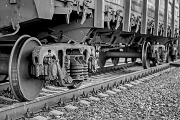 Freight train, iron wheels train close-up, black and white color