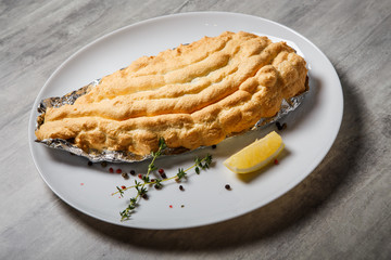 delicious  baked dorado under egg whites with herbs