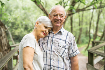Happy old elderly caucasian couple in a park
