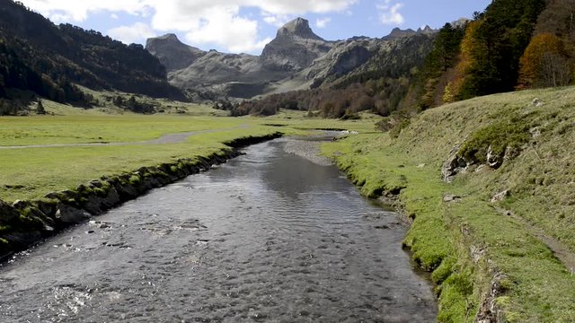 view of Pyrenees mountains with small river near Pic Ossau