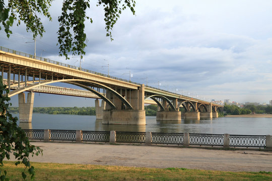 Automobile bridge over the Ob river in summer evening in Novosibirsk