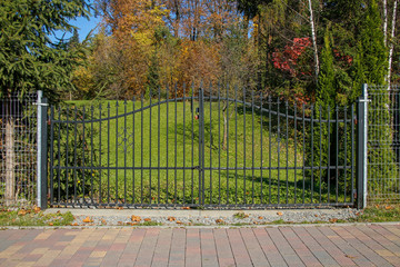 metal modern gate in autumn scenery