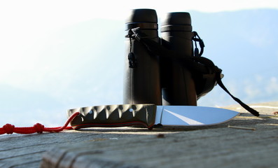 black binoculars with sharp knives  