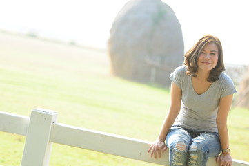 Asian girl smiling and feeling happy in the park in a sunny summer day, Have a beautiful day and happy concept.