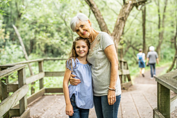 Grandmother and granddaughter spend the weekend in the park