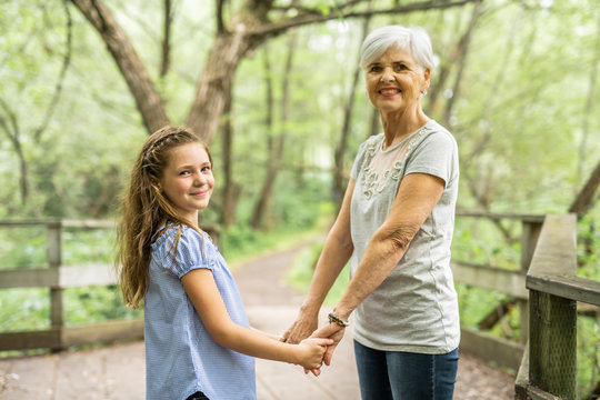 Grandmother and granddaughter spend the weekend in the park