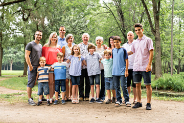 Large family with cousin grandparent father and kid on a forest